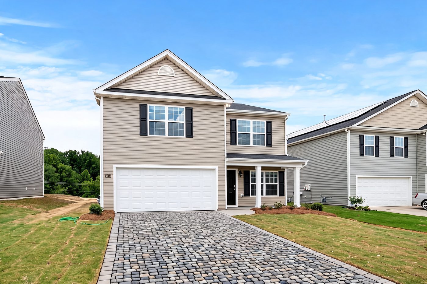 The same driveway & front redesigned by AI in the Coastal style